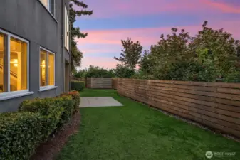 The backyard is located right off the recreation room and the family room.  The grass has been edited as it is growing in.