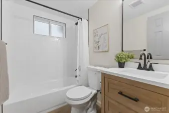 Full bath with beautiful fixtures and design.