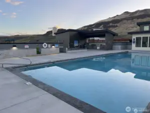 View of the pool, hot tub and barbeque area