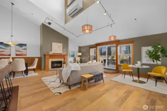 Airy main living space anchored by vaulted ceilings and expansive windows, creating a bright and welcoming everyday retreat.