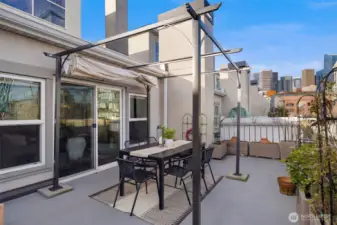 Alternate view of the rooftop highlighting generous square footage and multiple areas to gather and unwind.