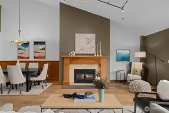 Another perspective of the living area showcasing architectural volume and an abundance of natural light.