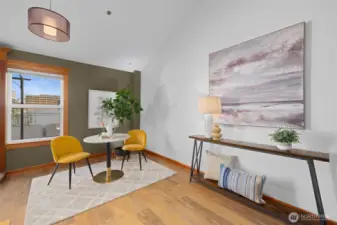 Stylish sitting area with built-in console and oversized windows—perfect as a reading nook, home office moment, or welcome space.