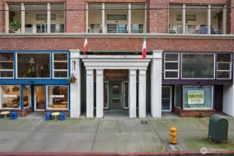 Classic brick façade with secure entry, reflecting timeless architecture and a well-maintained urban building.