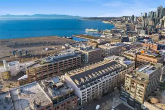 Sweeping aerial perspective featuring the waterfront, marina, and the city’s connection to Puget Sound.