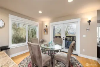 Eating nook off kitchen opens to sliding doors to exterior back deck