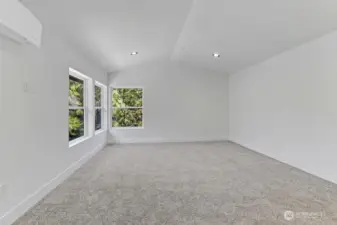 Primary Bedroom w/vaulted ceilings and tons of light