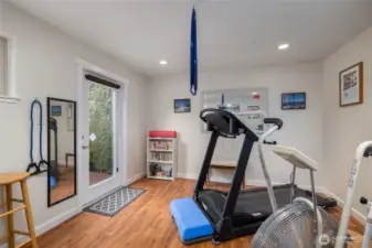 Get up in the morning and head just steps away to get your exercise in for the day!  Door opens to a small additional deck, just waiting for your hot tub addition!