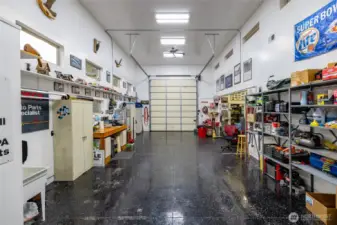 Owner formerly restored cars and this shop is incredible in every way. Half bath located to the left, and workshop and storage area to the right. Free standing heat and AC included!