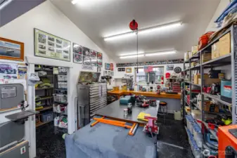 Storage area to the left and robust built-in work bench.  Safe under bench stays.