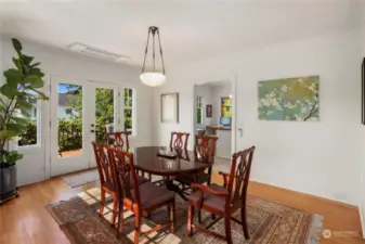 Large formal dining room with Frech doors opening to the west facing deck.  All new HVAC including heat pump and air conditioning -- see ceiling vent by the French doors.  Each unit is individually controlled.