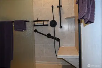 Stone walk in shower with all matte black fixtures