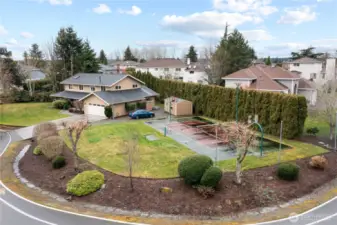 .43 acre lot offers room to roam with sport court, decks, patio and Mt Rainier view