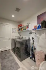 Then the laundry room, with additional storage space and garage access.