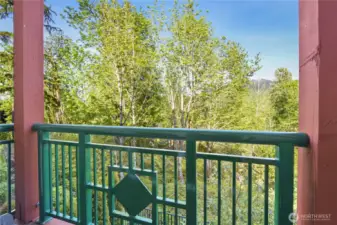 quiet balcony overlooking a serene greenbelt, offering a peaceful retreat with a deep connection to nature