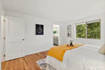 Wake up to soft light and soothing tones in the primary bedroom, complete with an updated ensuite and heated tile floors.
