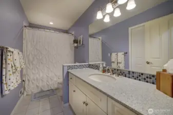 Upstairs bathroom with tub