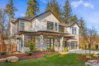 Stunning Curb appeal. Custom lansdcape design utilizes large natural stones, mature trees, custom built corten steel planting beds, and high end lanscape lighting. 3rd of this limited offering of 4 custom residences by one of the regions most respected names