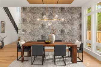 Stunning designer wallpaper feature wall and custom built rift oak ceiling detail create a dramatic dedicated dining space