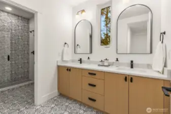 One of 3 Second Floor baths. Custom cabinets with designer slab counters, double sinks, designer tile details and frameless glass shower enclosure