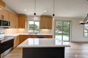 Kitchen with sliding glass door to deck