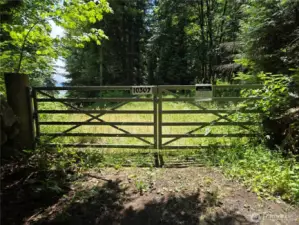 Park here and walk to the Left to get onto the lot. Building site is behind this gate to the left.