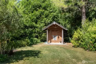 Adorable pumphouse with storage! This property has a lovely variety of mature trees and shrubs, all planted with love by the owners.