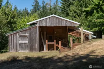 Lower "tractor barn" shop. Storage room up stairs in center. House off camera behind and on the right.
