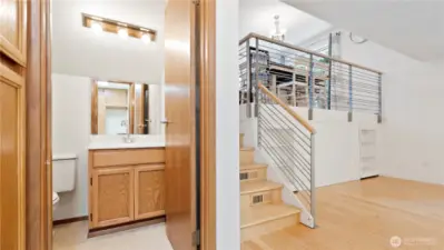 .25 Bathroom on lower level leading up to kitchen.