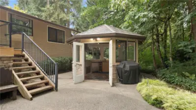 Patio + Outdoor Kitchen & Entertainment Room.