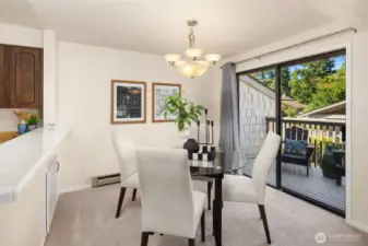 Flexible dining space looks out to a private deck.