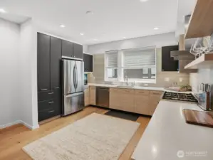 Spacious, modern kitchen is gorgeous & bright.