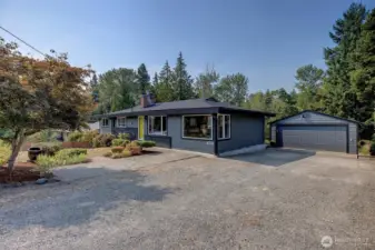 Ample off-street parking with attached two- car garage, storage, and extra driveway space
