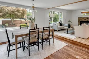 Sunlit dining space with easy flow to both the kitchen and living areas