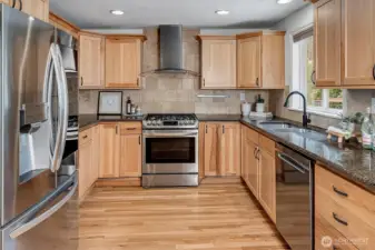 Updated kitchen with sleek cabinetry, granite counters, and stainless appliances—perfect for everyday cooking or entertaining