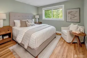 Primary bedroom with oversized windows and generous closet space for comfort and convenience