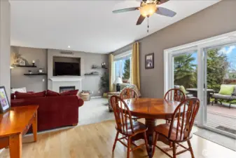 Eating nook off kitchen opens to the family room.