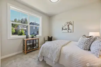 Bedroom 2. Pictures depict a previously built home similar to the home going to be built on this lot. Floor plans, Elevations, colors, upgrades & materials may be different.