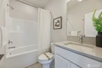 Full bathroom. Pictures depict a previously built home similar to the home going to be built on this lot. Floor plans, Elevations, colors, upgrades & materials may be different.