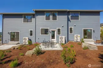Back of triplex. Pictures depict a previously built home similar to the home going to be built on this lot. Floor plans, Elevations, colors, upgrades & materials may be different.