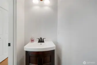 There is a half bath just off the family room on the main floor.