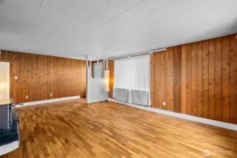 Living room with large front window.