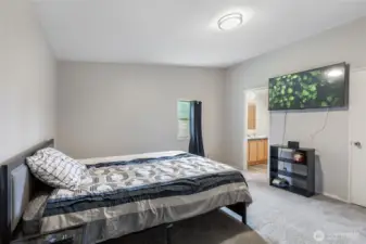 Bright and roomy primary suite with walk-in closet.