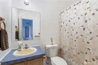 Conveniently located secondary bathroom.