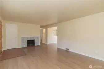 Brick wood burning fireplace in formal living room