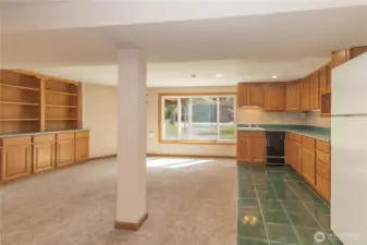 Another view of the huge built-ins to left and kitchen cabinetry