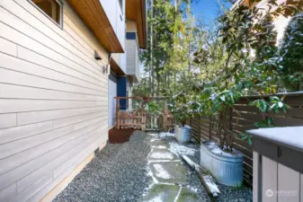 Three separate sections outside, all fully fenced. This may be a perfect dog run, with a storage shed and access to the garage as well. Pretty dwarf magnolia trees as a bonus