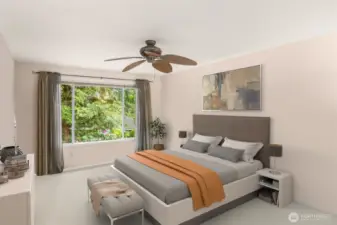 Primary bedroom is spacious and full of natural light
