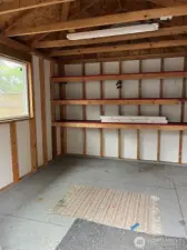 Shed has shelving to hold those craft makings, or garden stuff.