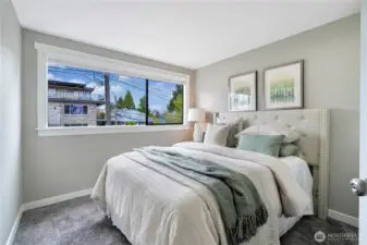 Two charming bedrooms on upper floor with natural light